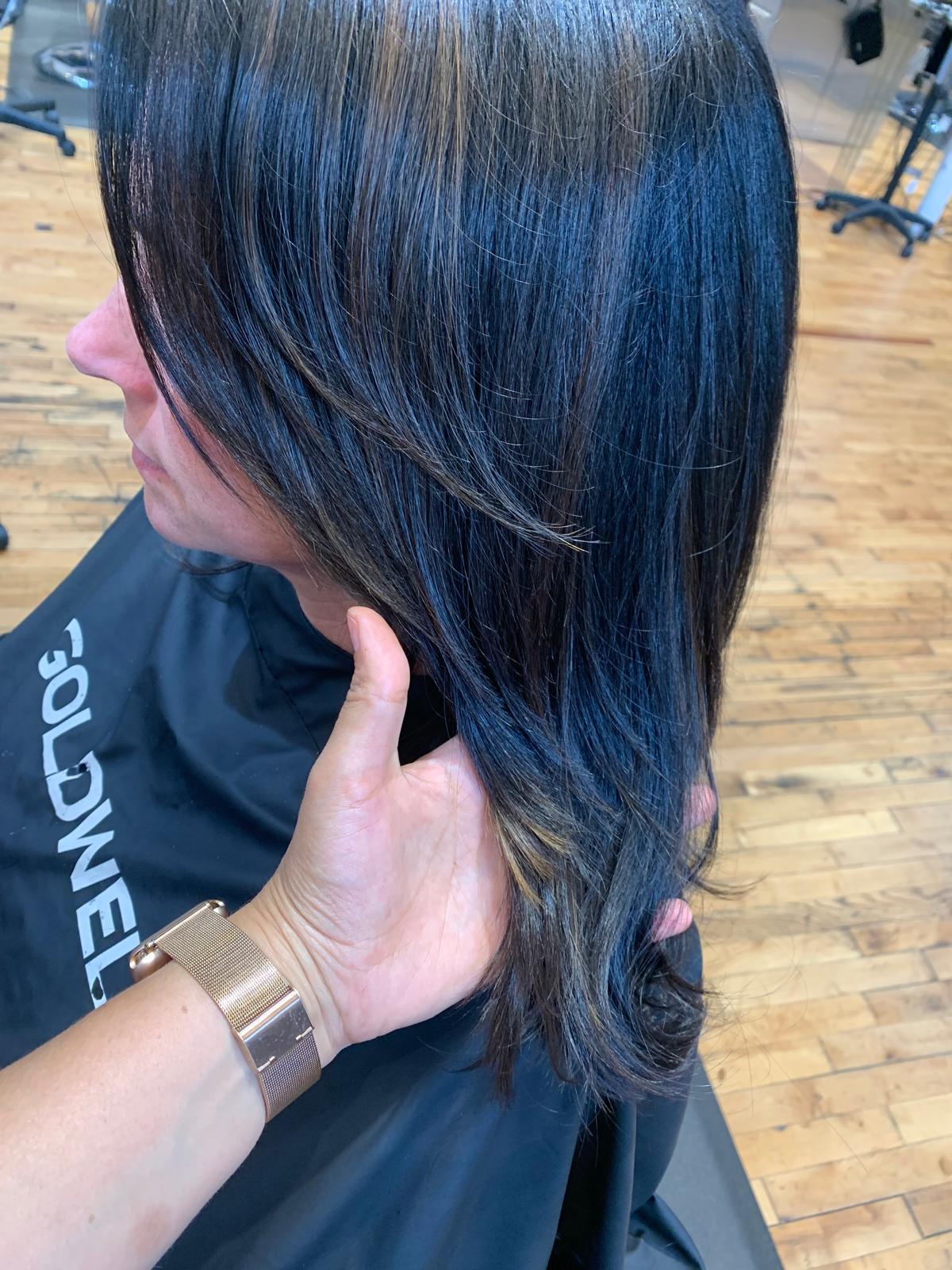 Dark hair with subtle highlights